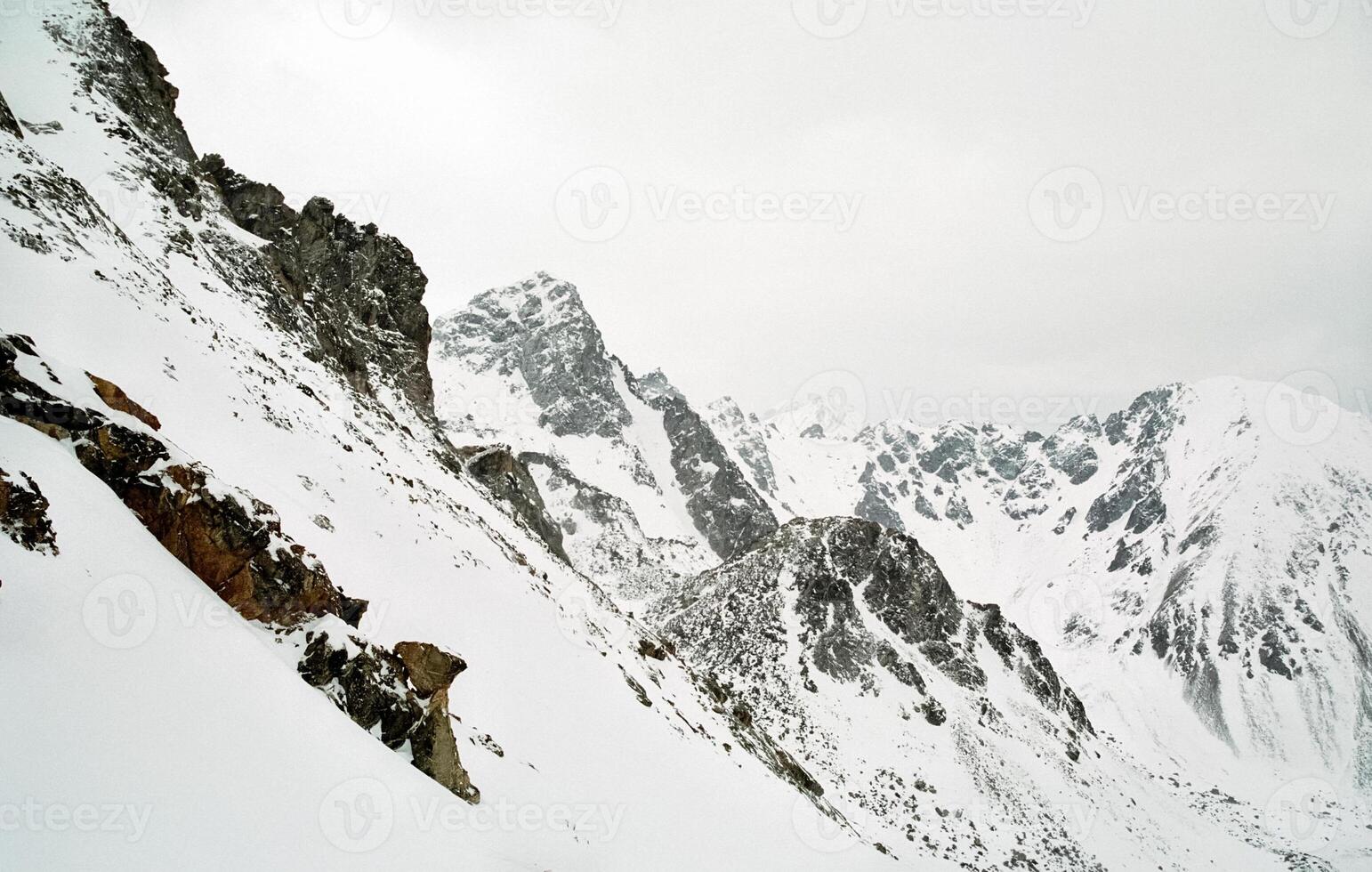 Mount Sayan in winter in snow. The nature of the mountains is sayan. photo