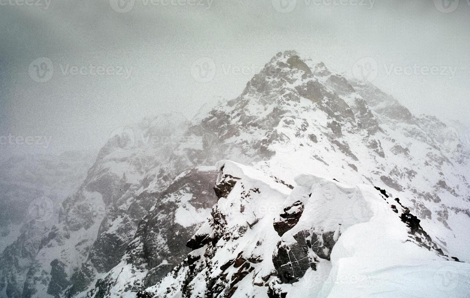 Mount Sayan in winter in snow. The nature of the mountains is sayan. photo