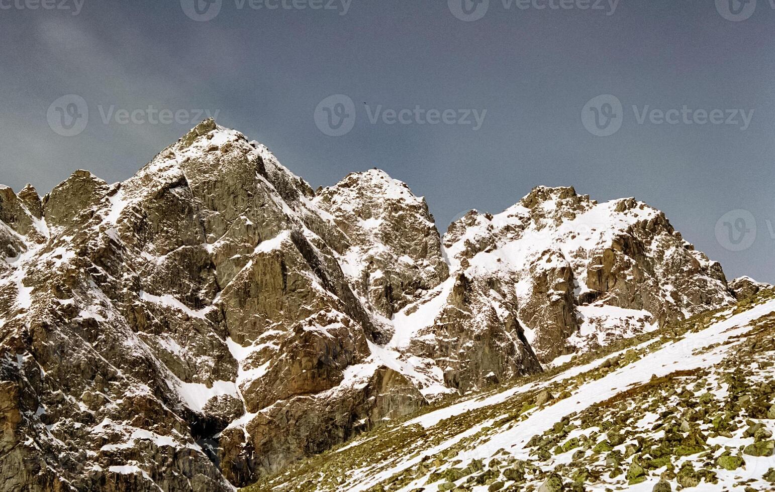 Mount Sayan in winter in snow. The nature of the mountains is sayan. photo