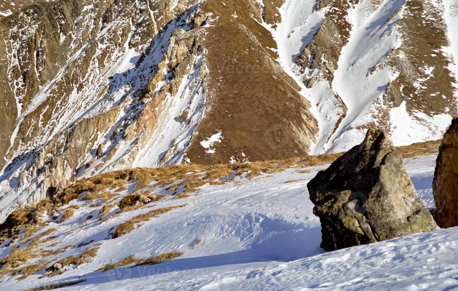 Mount Sayan in winter in snow. The nature of the mountains is sayan. photo