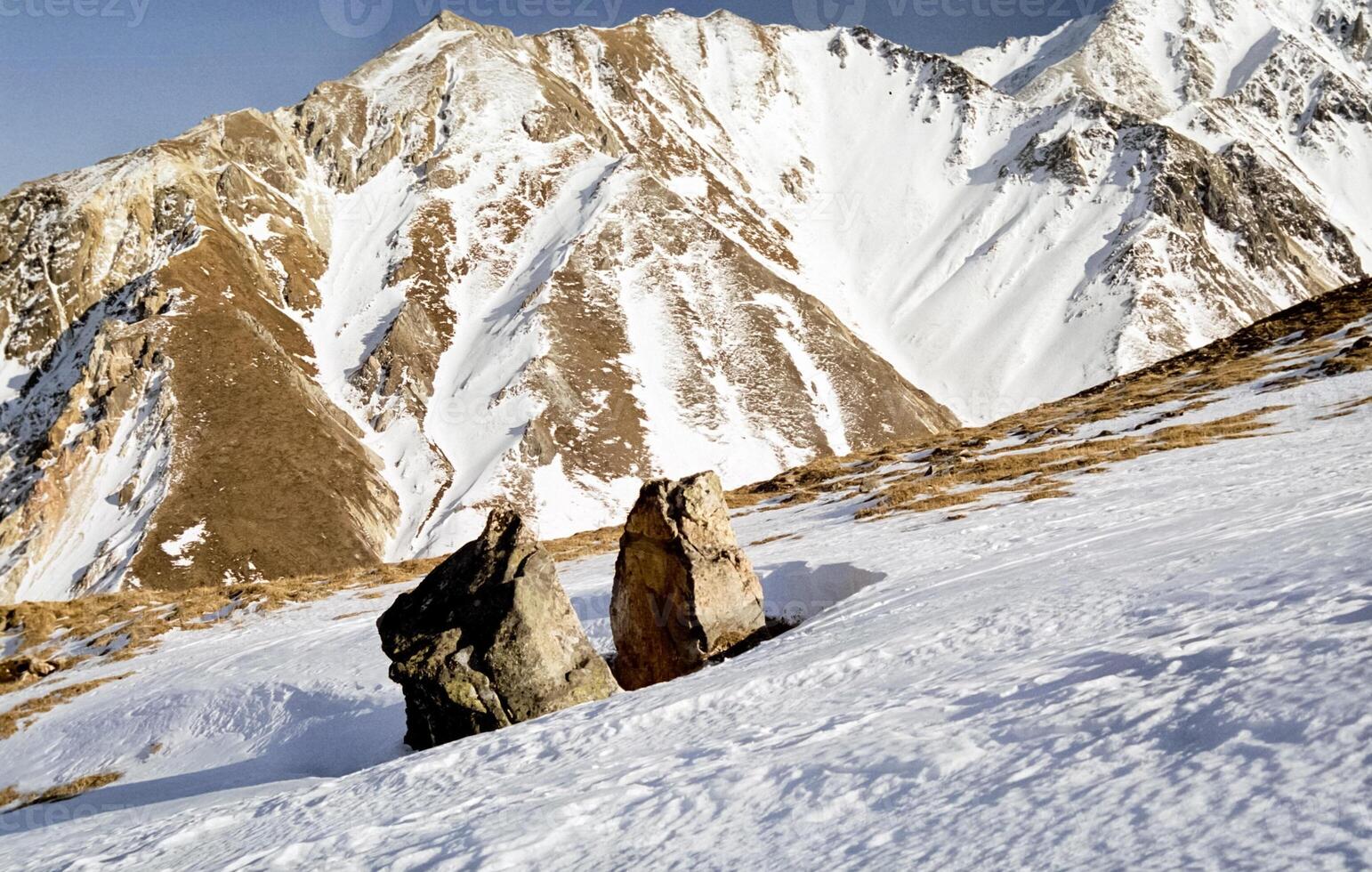 Mount Sayan in winter in snow. The nature of the mountains is sayan. photo