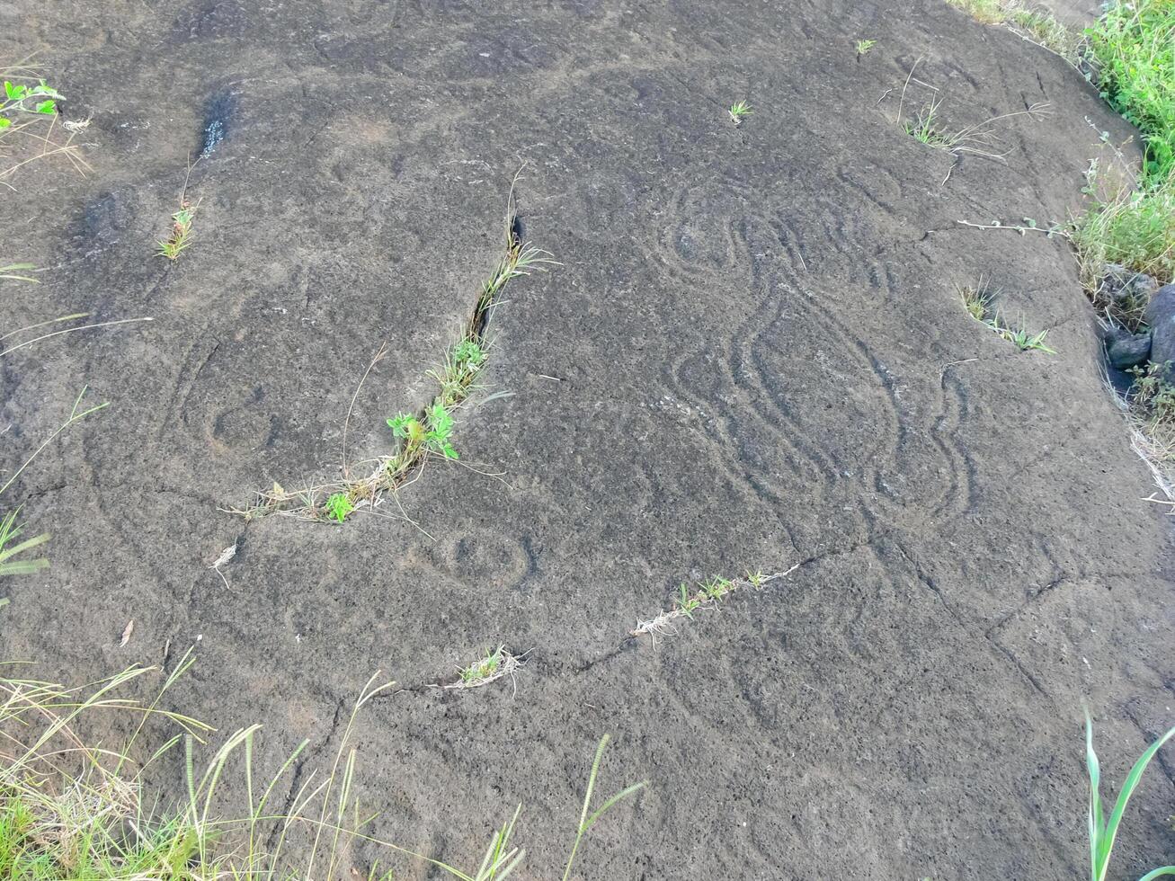Stone slabs with drawings on Easter Island. Traces stone processing on plates. photo