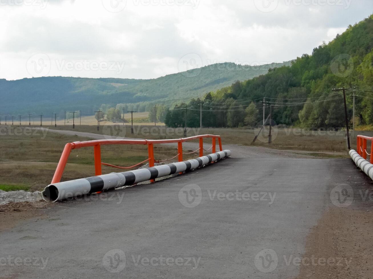 The bridge on the Belarusian tract. bridge over a mountain river. photo