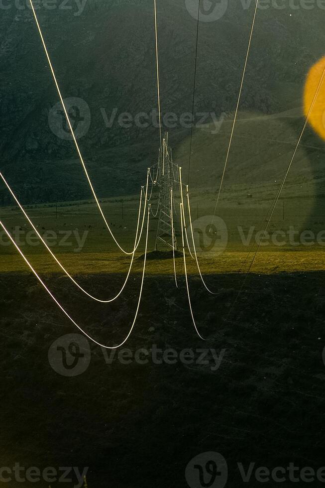 High voltage power line wires, view from another support line tower. photo