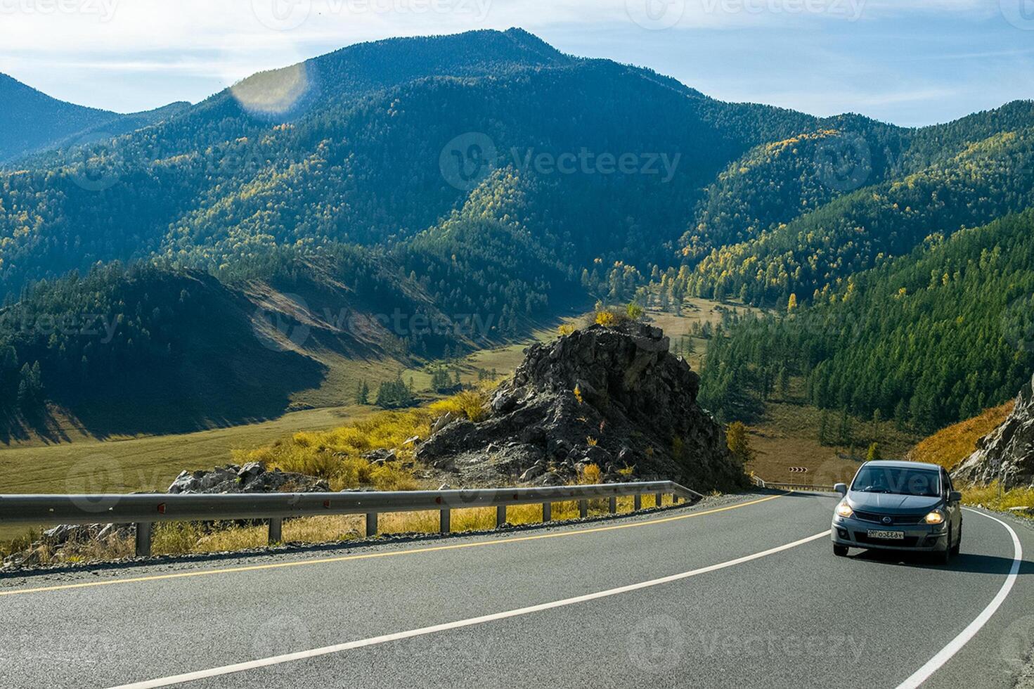 Asphalt road to the mountains. Mountain track on Altai. photo