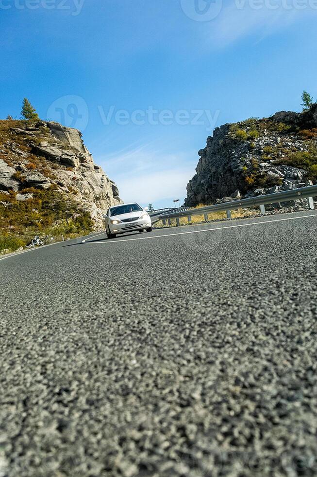 Asphalt road to the mountains. Mountain track on Altai. photo