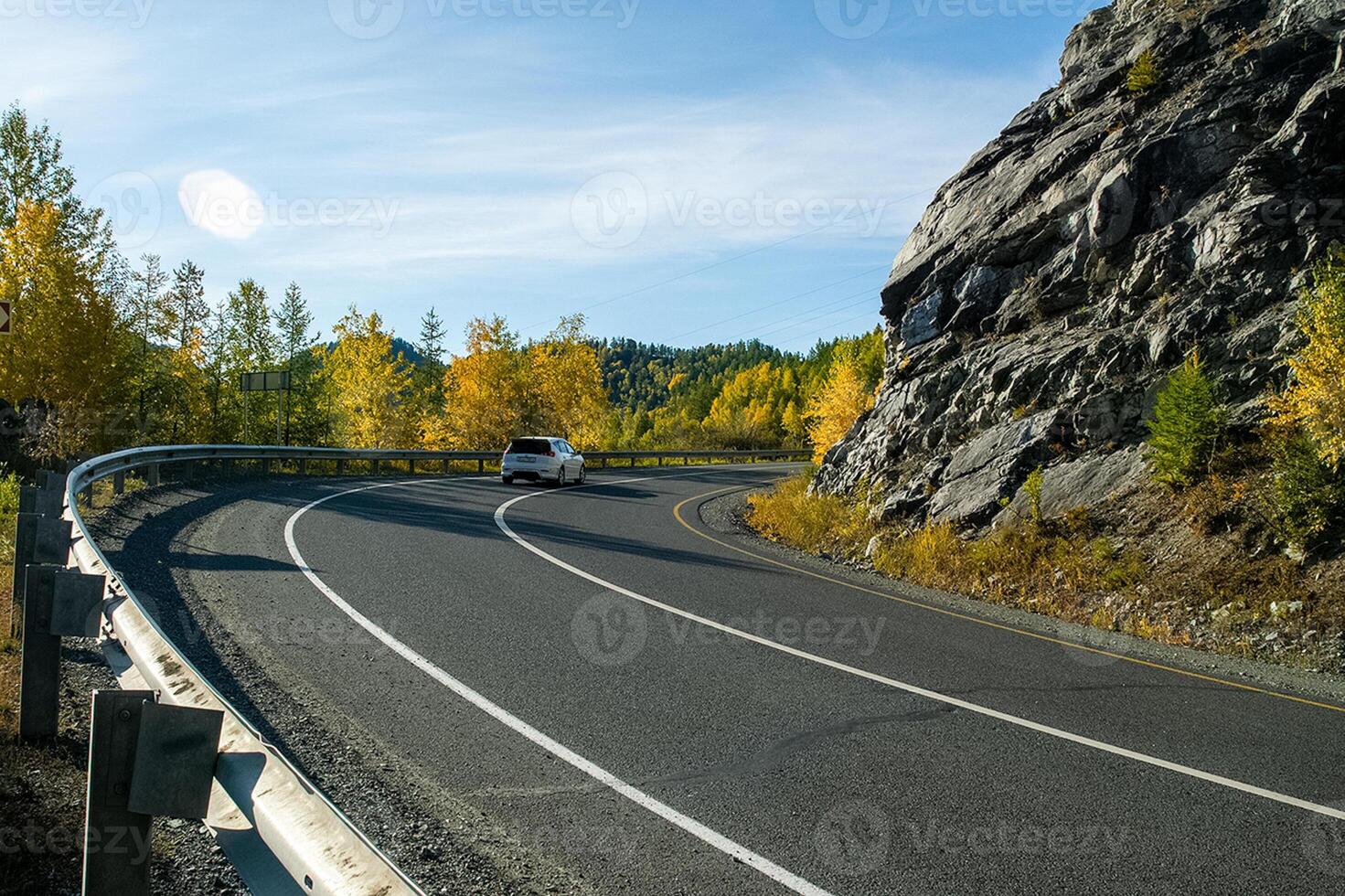 Asphalt road to the mountains. Mountain track on Altai. photo