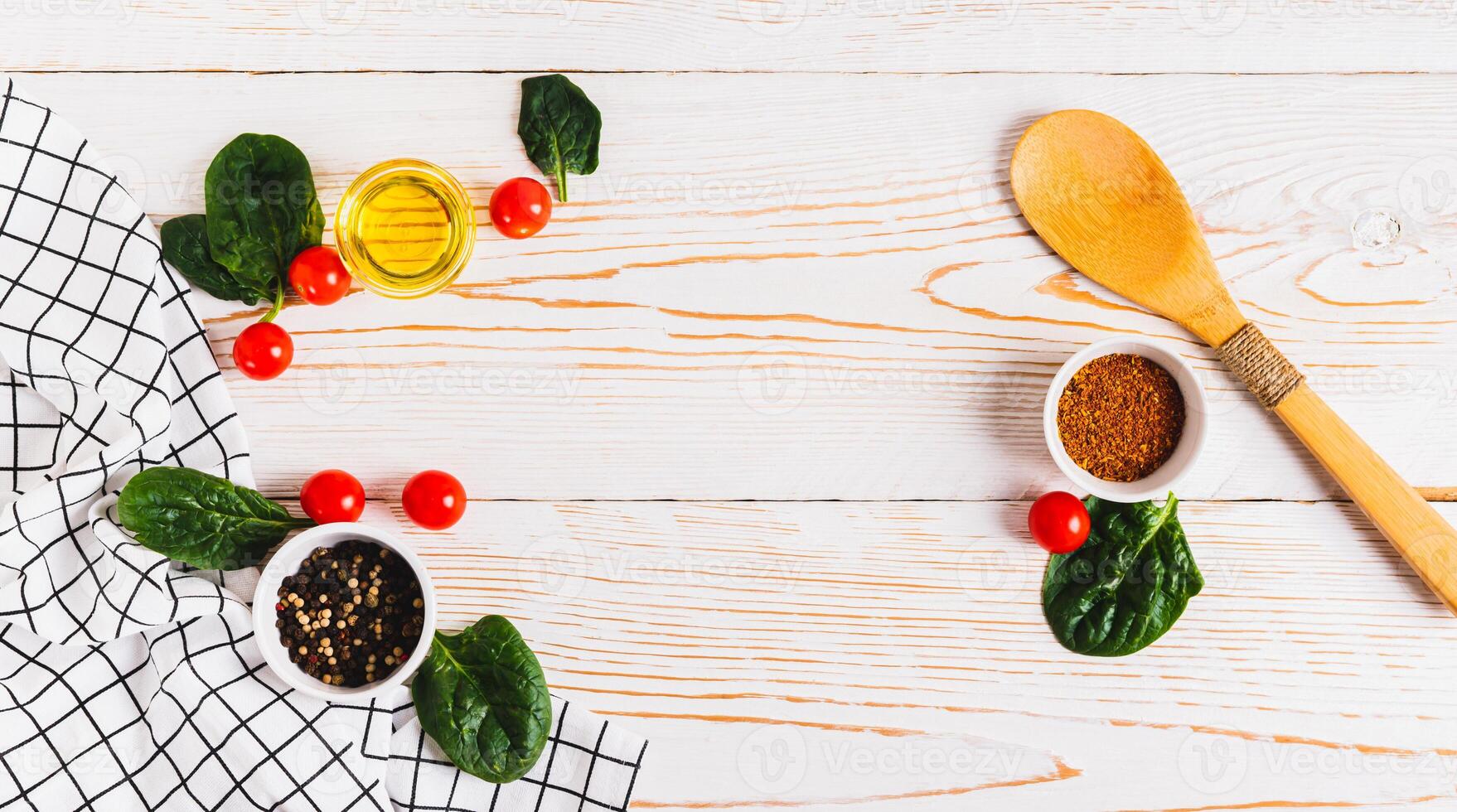 Cooking set spices, vegetables and herbs on white wooden background photo