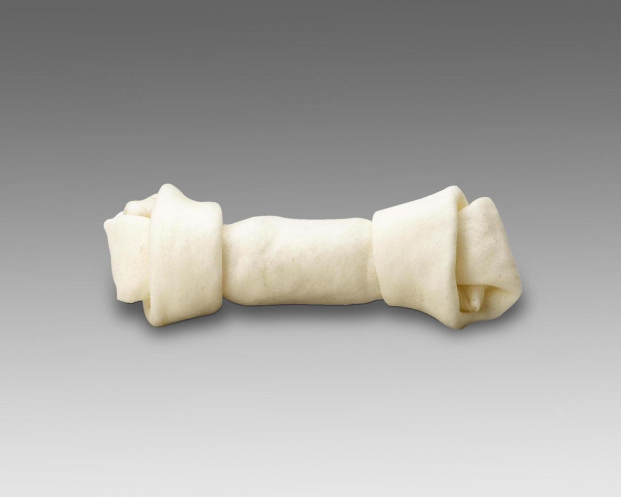Dog bone on a gray background photo