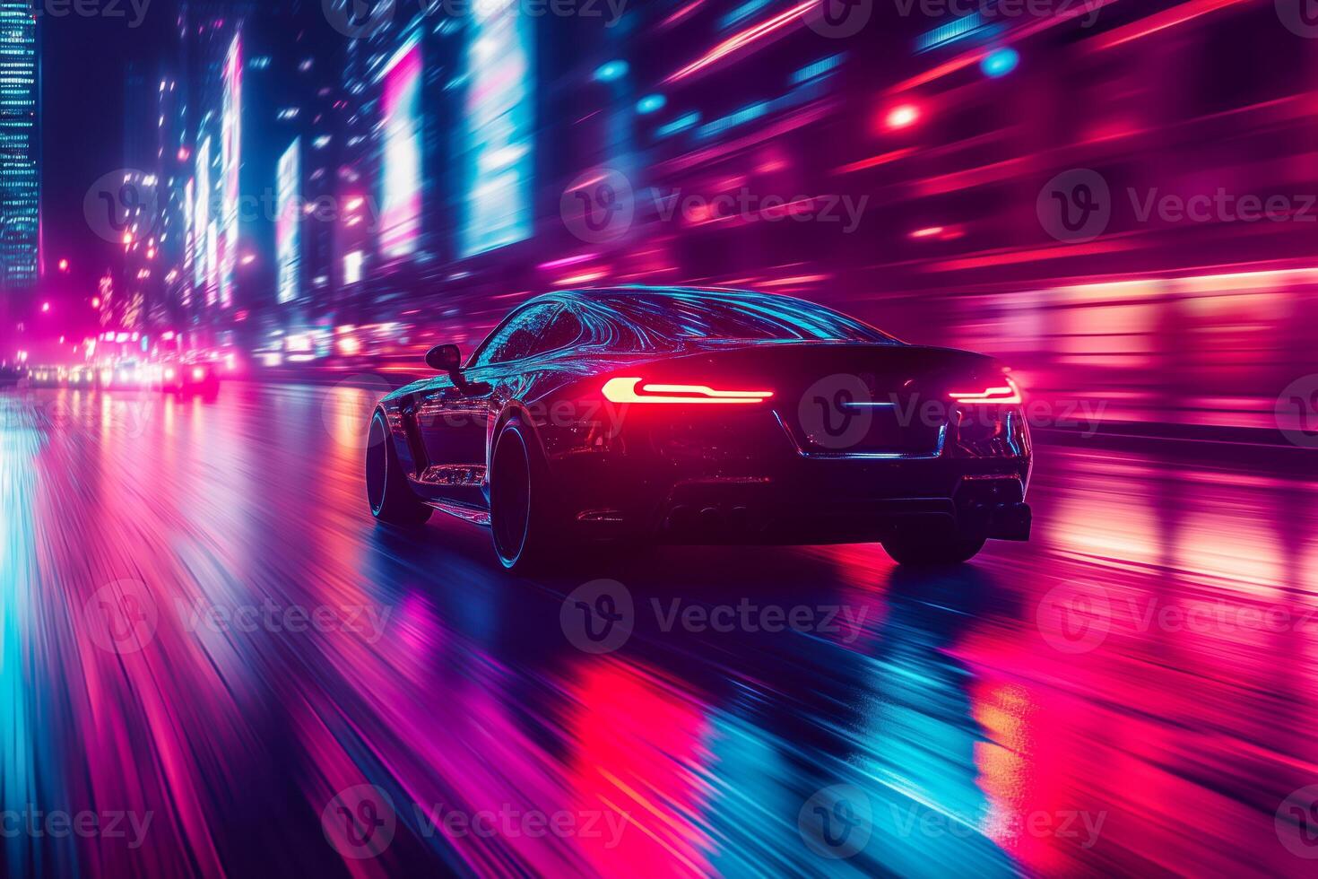 A car driving down a city street at night photo