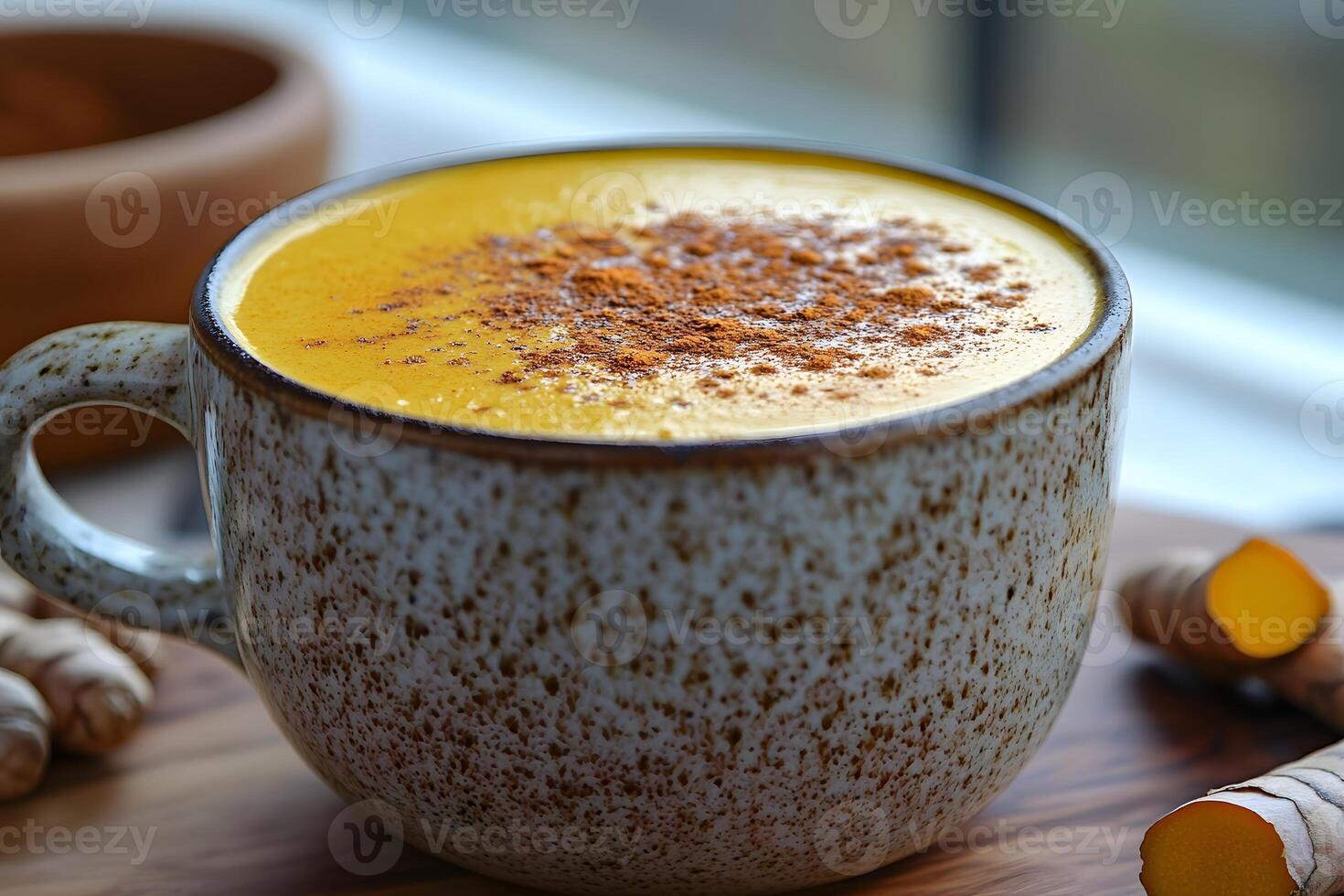 Warm Spiced Turmeric Latte in Rustic Ceramic Mug for Cozy Moments photo