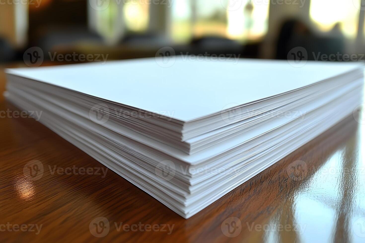 Stack of Blank Printer Paper on Wooden Desk in Sunlit Office photo