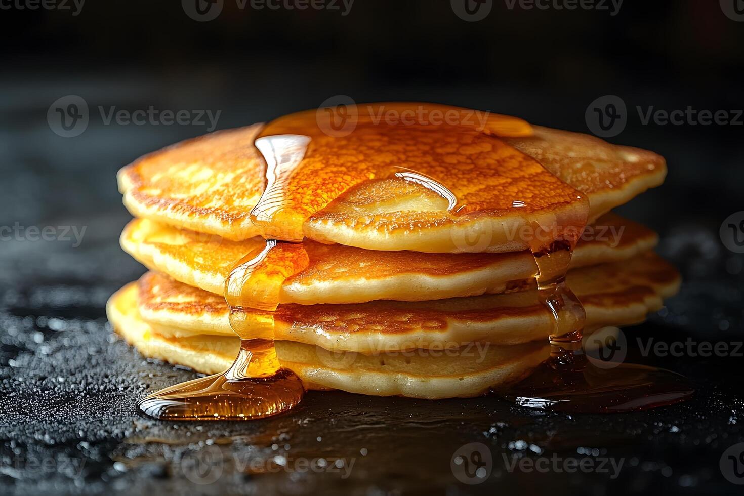 Delicious Stack of Golden Pancakes Drizzled with Maple Syrup for Breakfast Delight photo