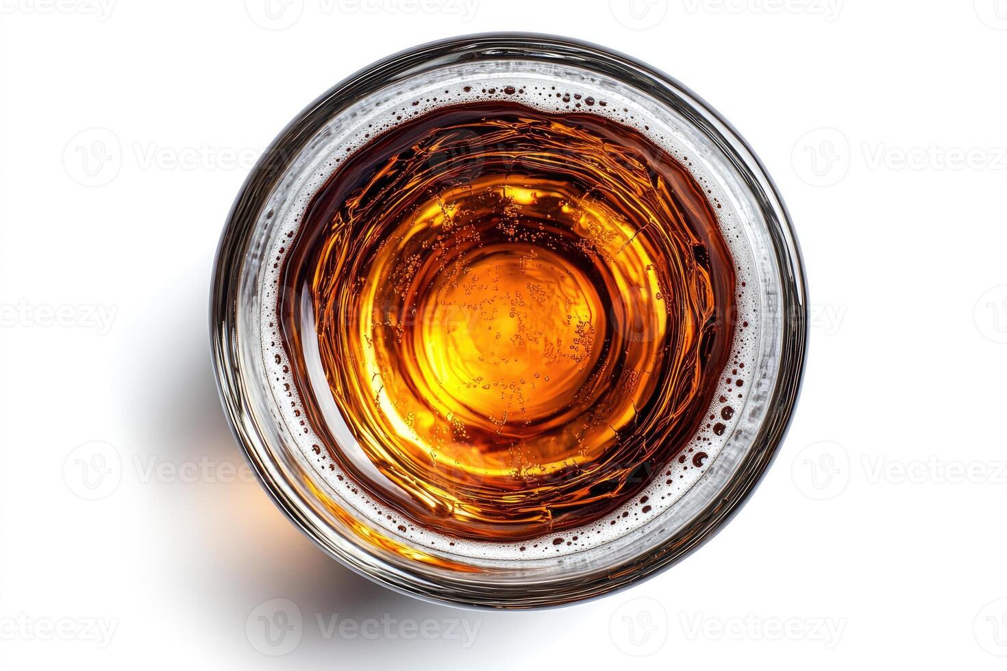 Glass of beer seen from above on white background photo