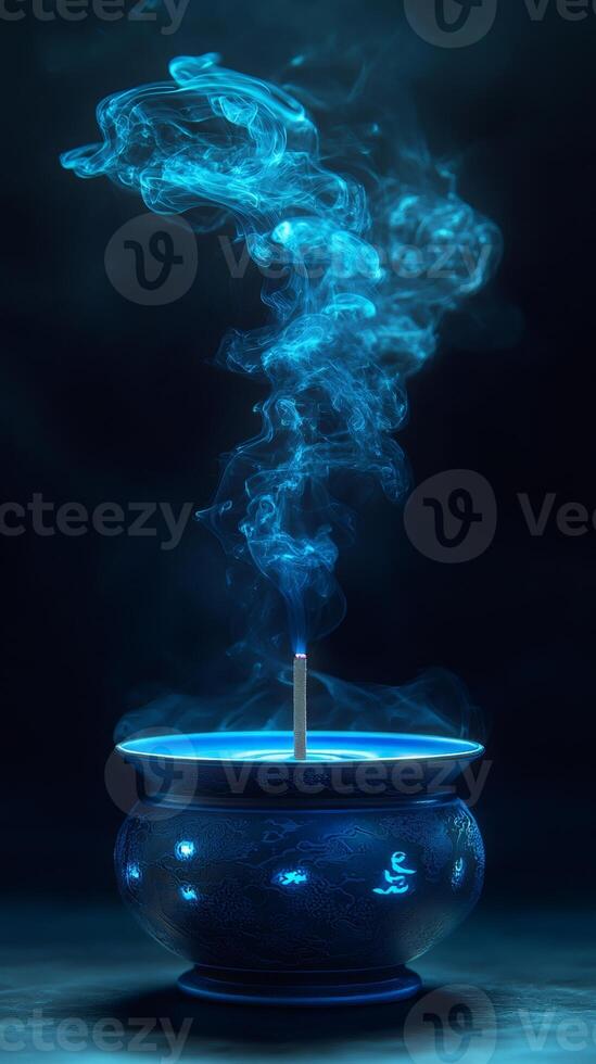 Blue incense stick burning, creating a mystical aromatic smoke photo