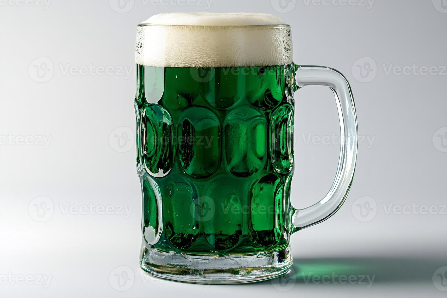 Large glass beer mug full of green beer celebrating saint patrick's day photo