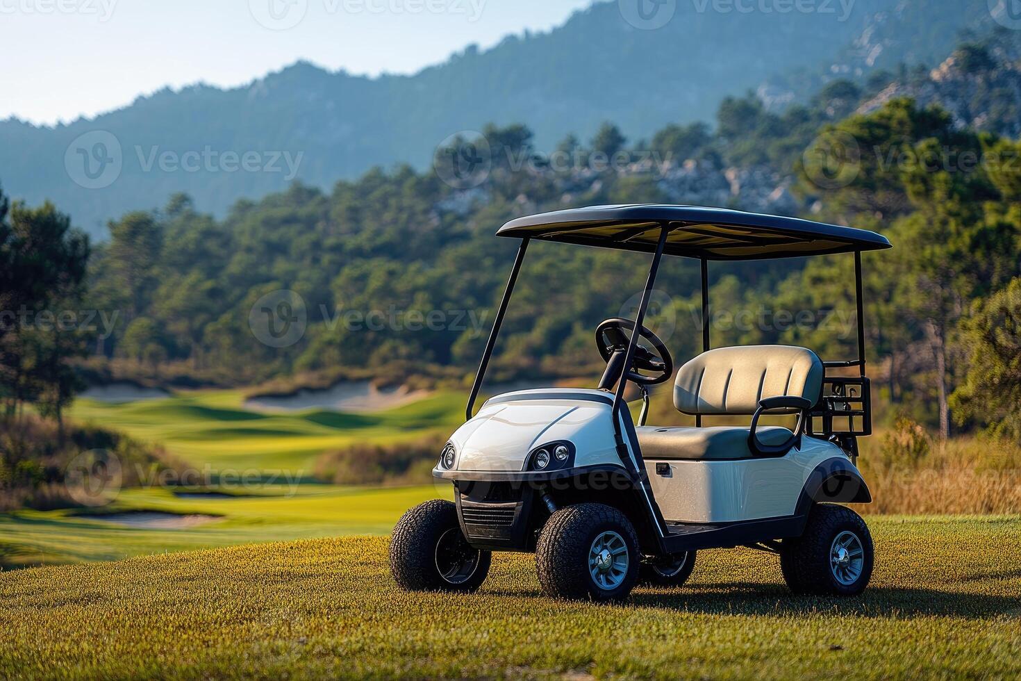 Golf cart parked on a beautiful golf course with mountain views at sunset photo