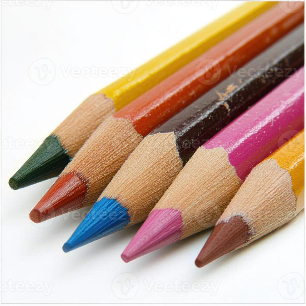 Colorful arrangement of colored pencils on a white surface showcasing vibrant hues and sharp tips for artistic creativity photo