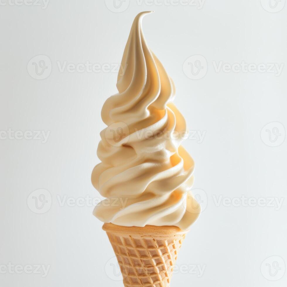 Creamy soft serve ice cream in a waffle cone against a light background showcasing its smooth texture and inviting swirl photo