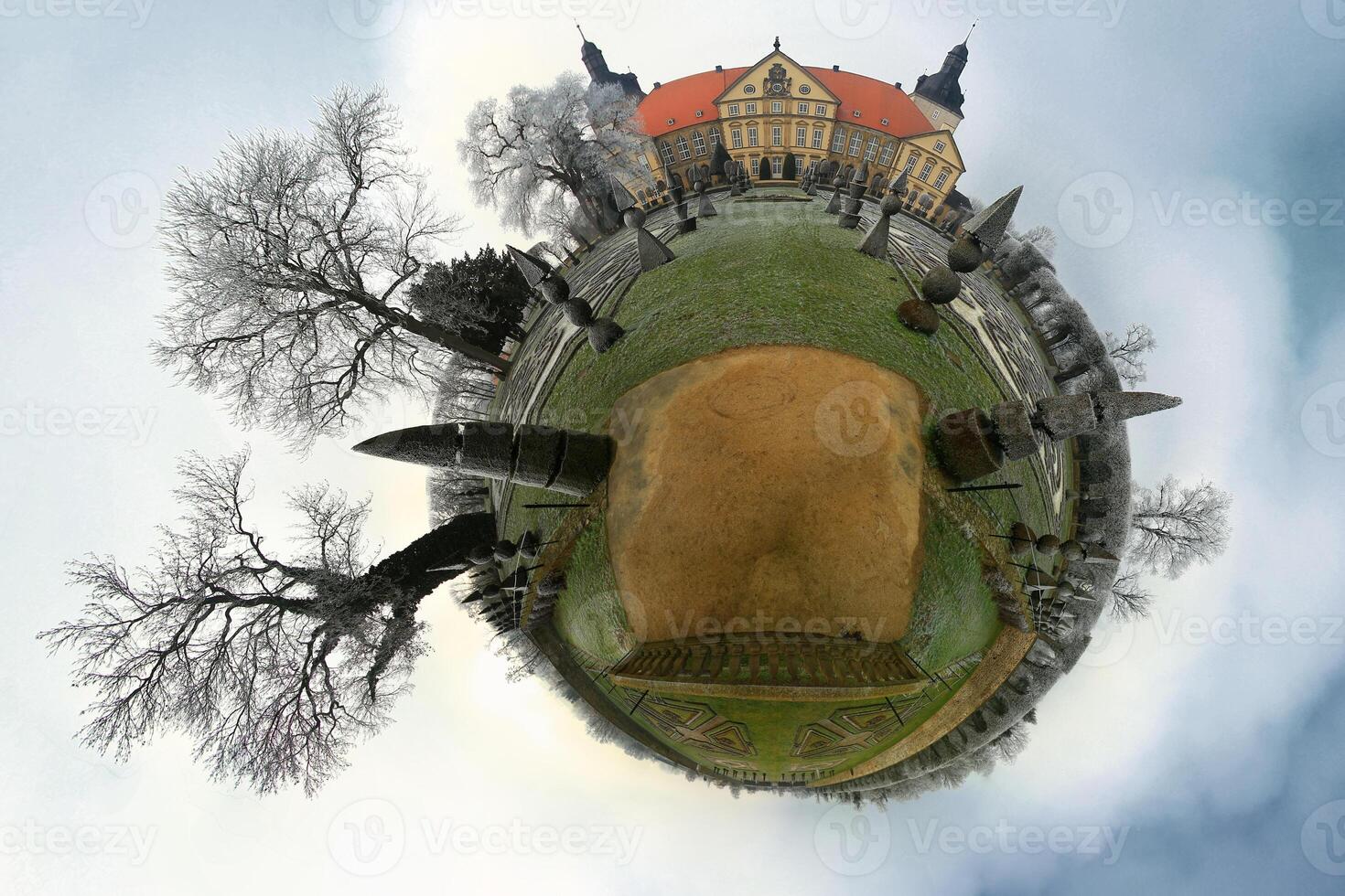 Little planet panorama of winterly Hundisburg Castle in Germany photo