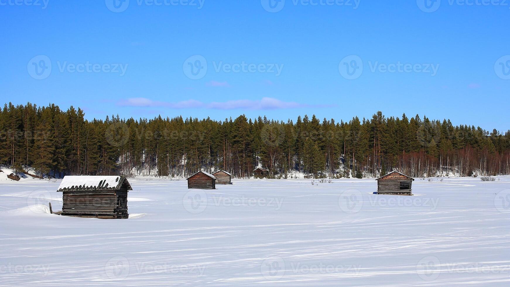 Simple storage sheds on Svansele Dammangar Svansele flowing water meadows in winter photo