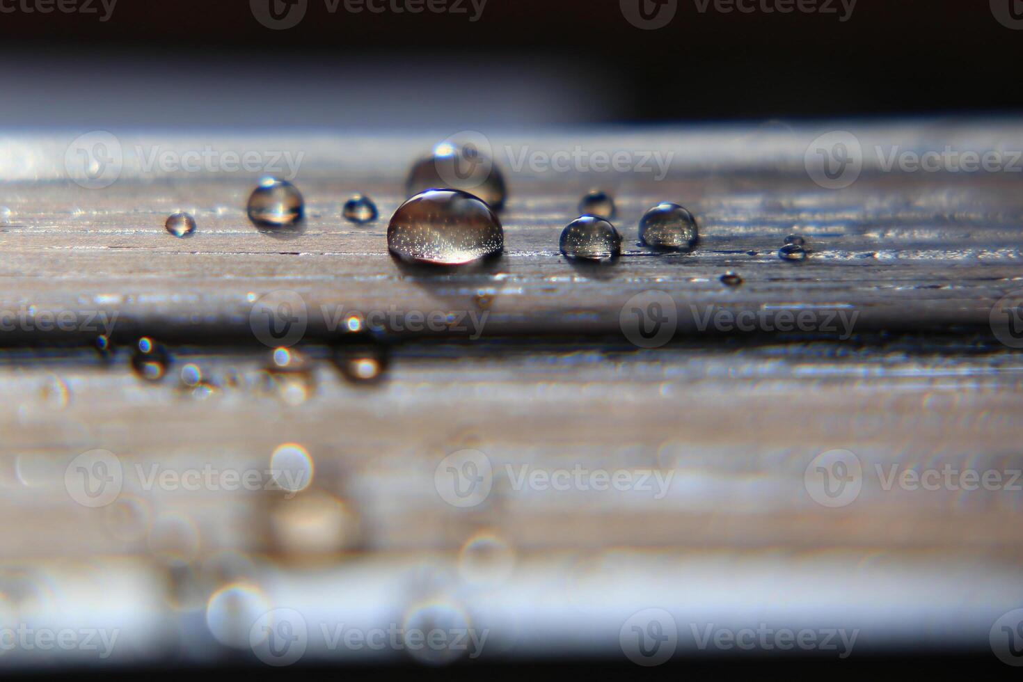 Hydrophobic surface of impregnated wood with water drops photo