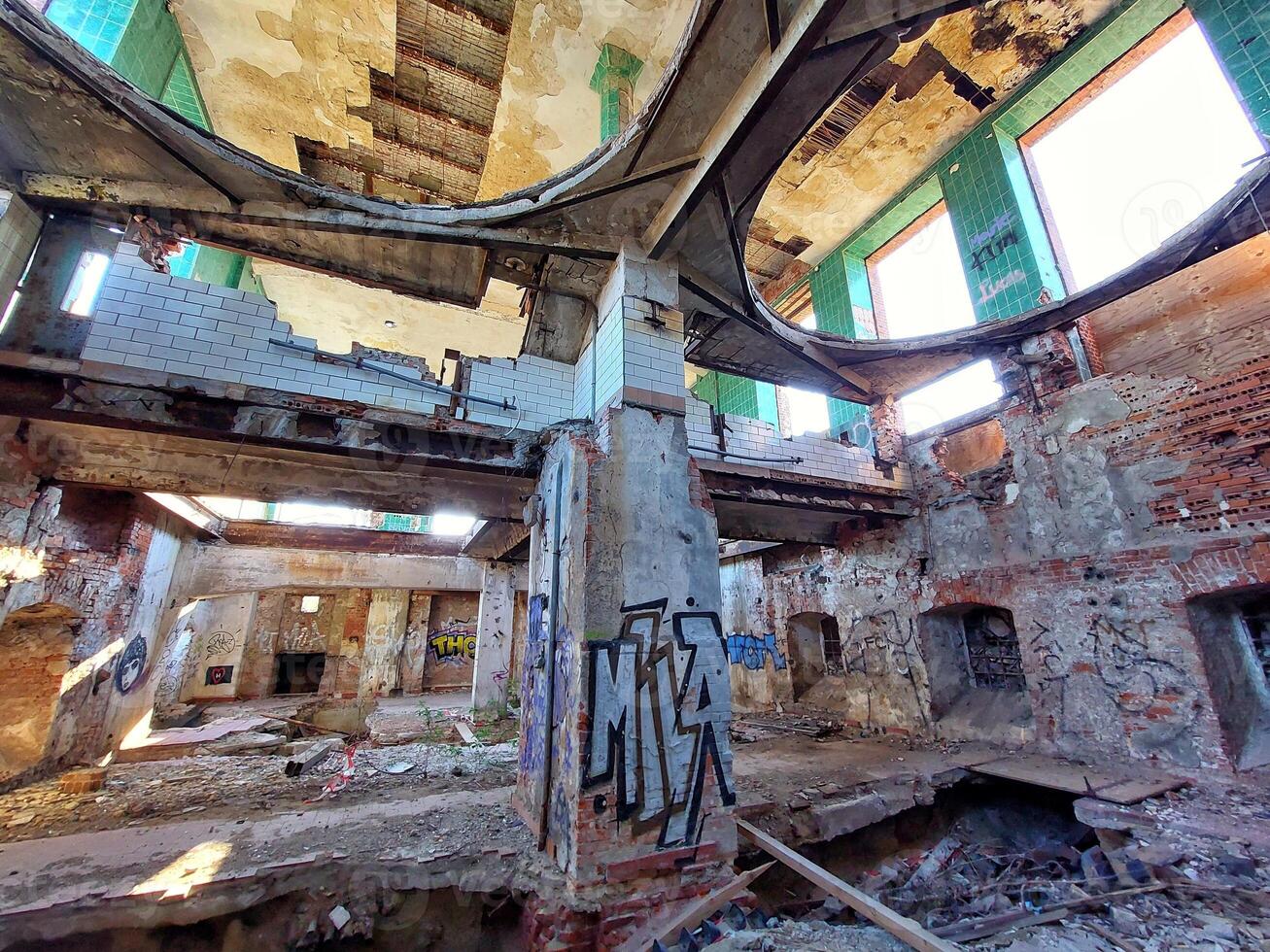Broken concrete basement of a long abandoned brewery in Germany photo