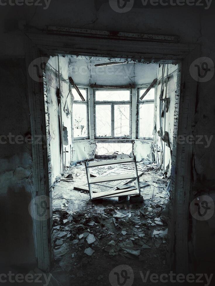 Grungy shot of ruined gazebo with leaning door and shelf photo