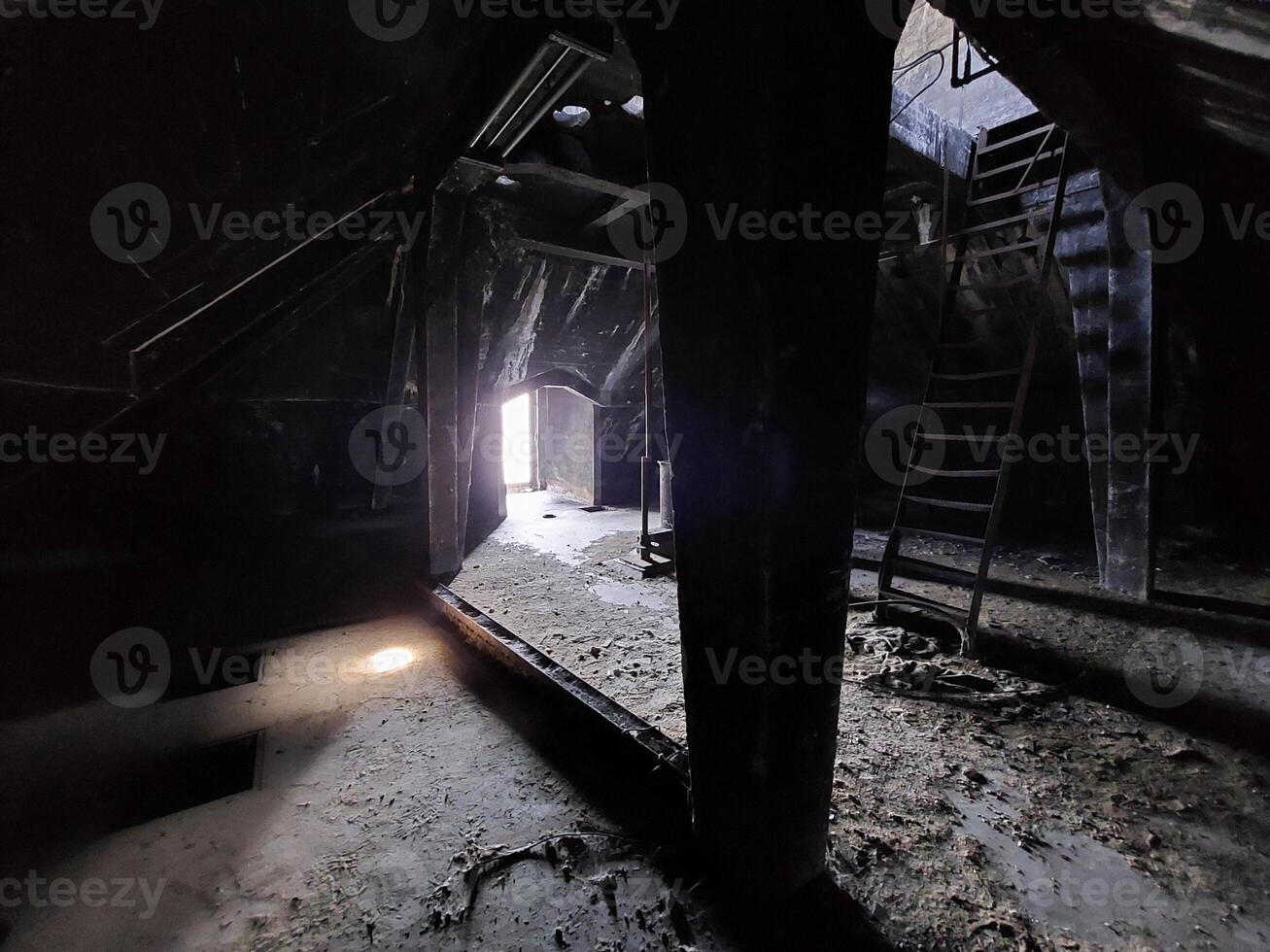 Dark and creepy room in an abandoned building photo