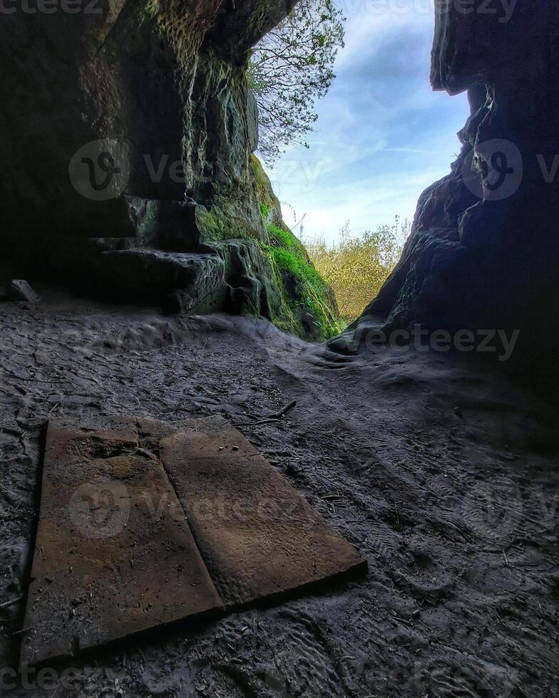 Cave with a simple mat used as a retreat for meditation photo
