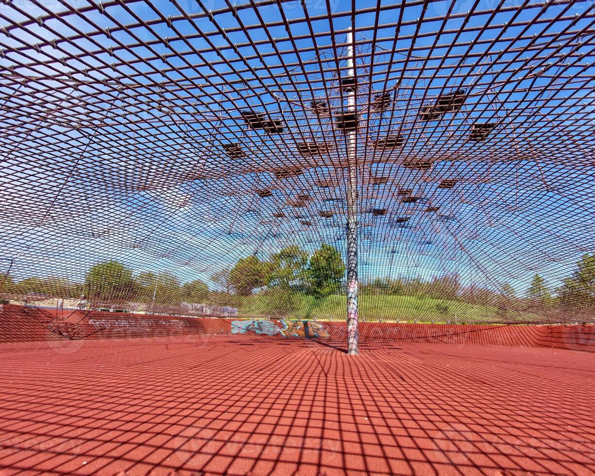Under the safety net of a climbing playground in a German city photo
