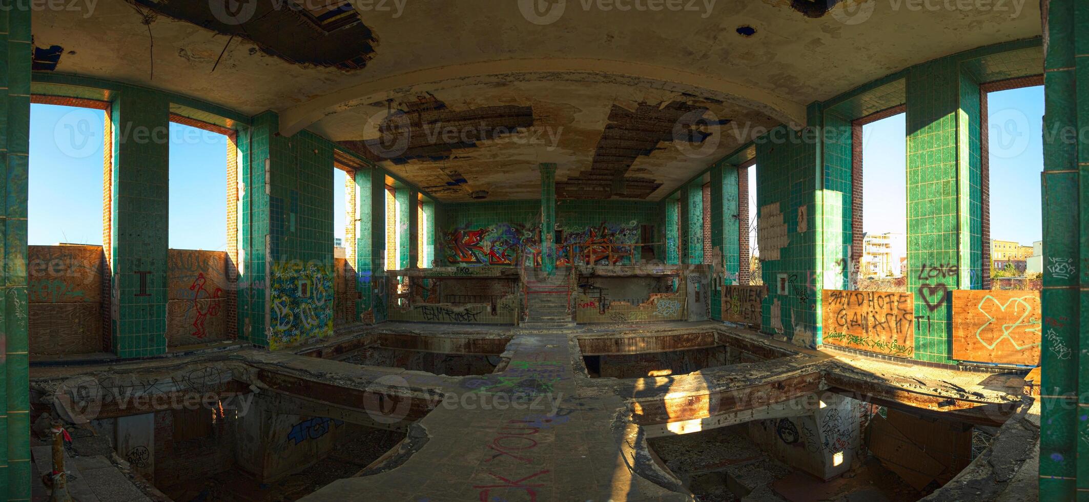 Empty tiled hall of a long abandoned brewery in Germany photo
