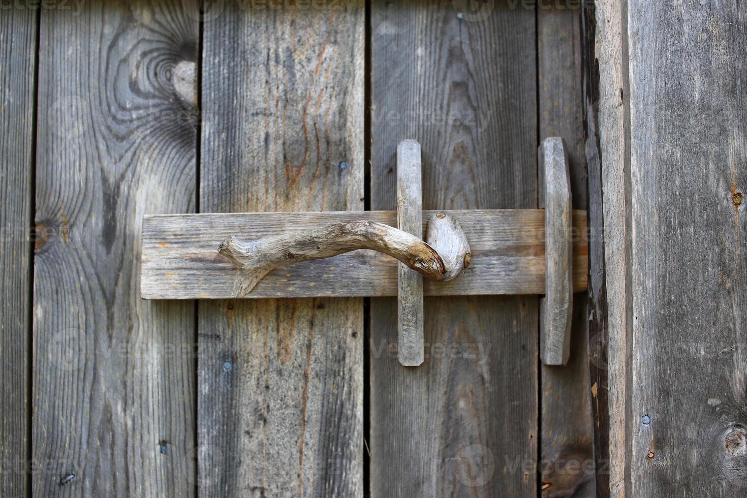 Rural door latch on a wooden door photo