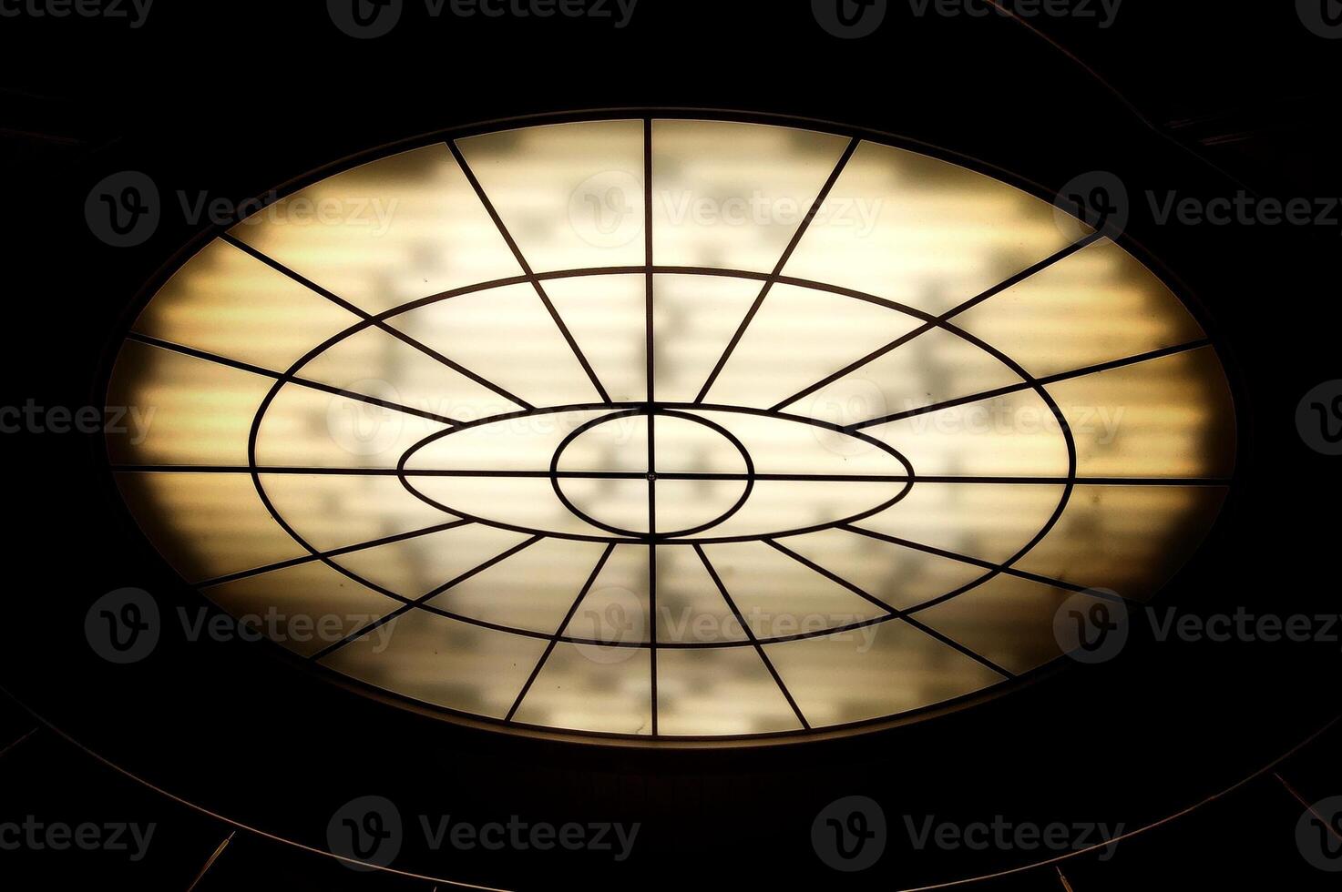 Conceptual high contrast shot of oval lighting at the ceiling photo