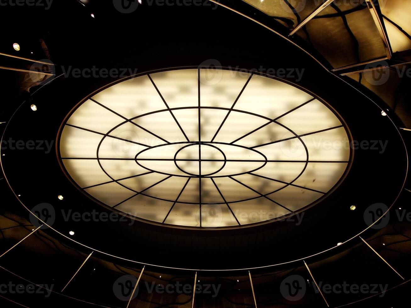 Conceptual high contrast shot of oval lighting at the ceiling photo