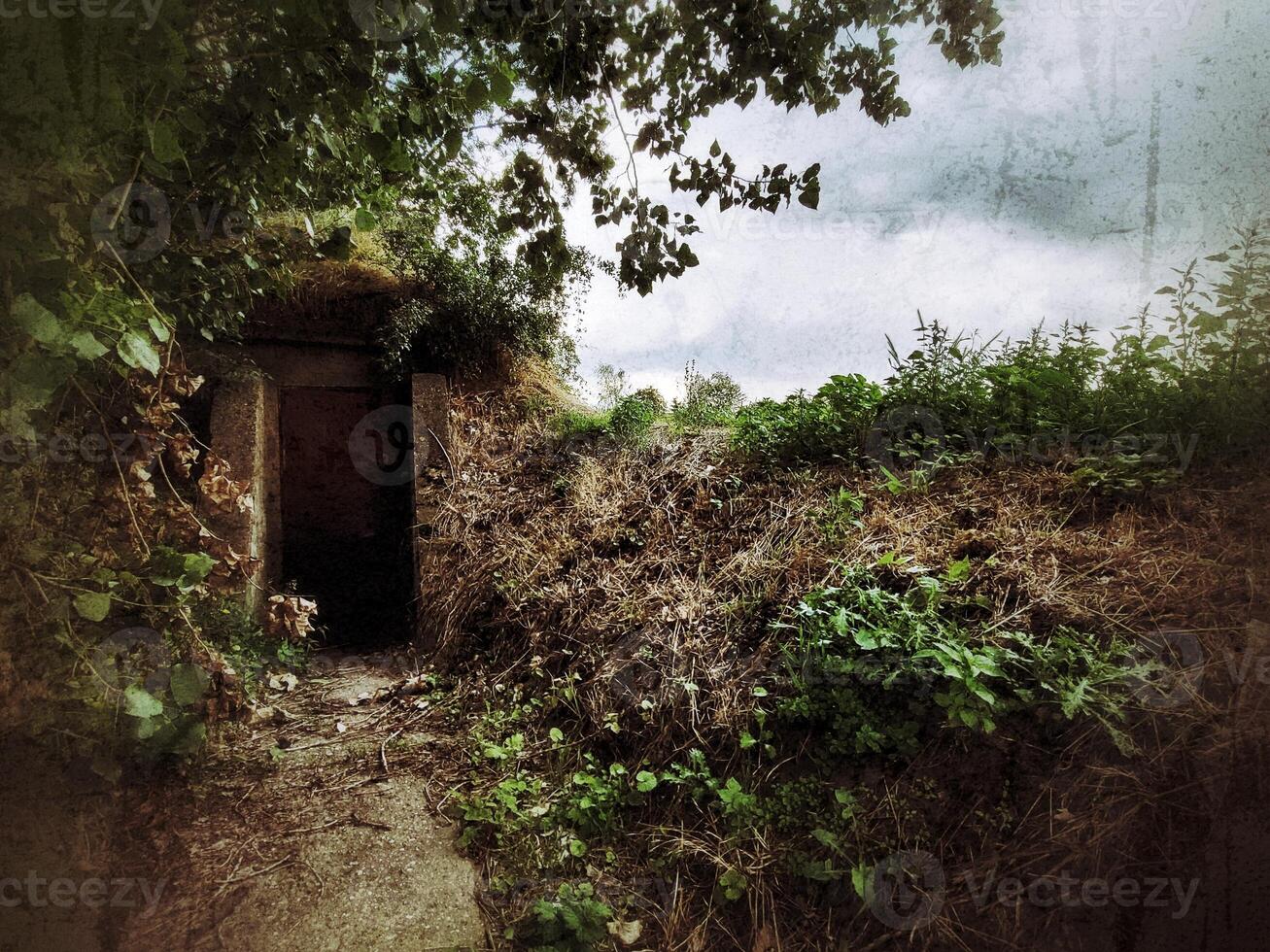 Grungy shot of entrance to bunker in Germany photo