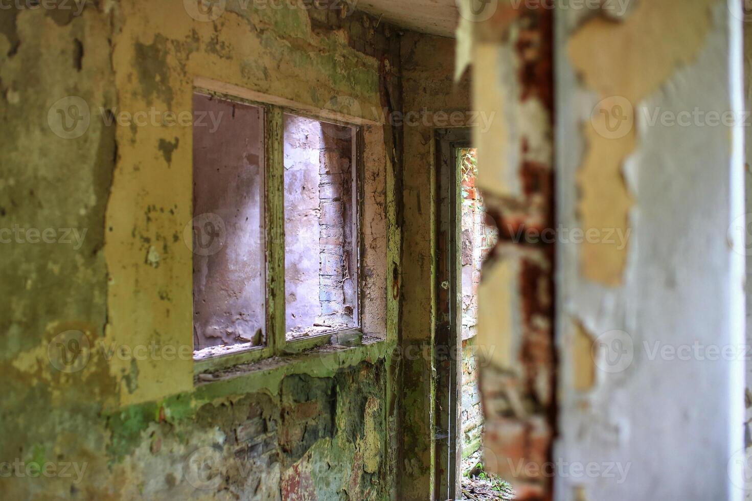 Broken and decayed entrance of an abandoned building photo