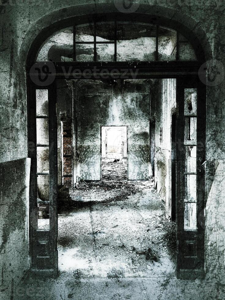 Creepy and grungy shot of corridor in an abandoned building photo