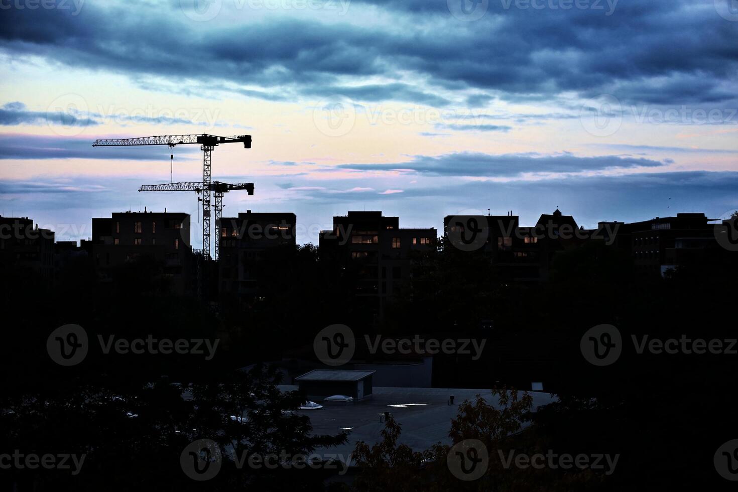 Sunset reflecting in windows of apartment blocks, high contrast shot in the evening photo