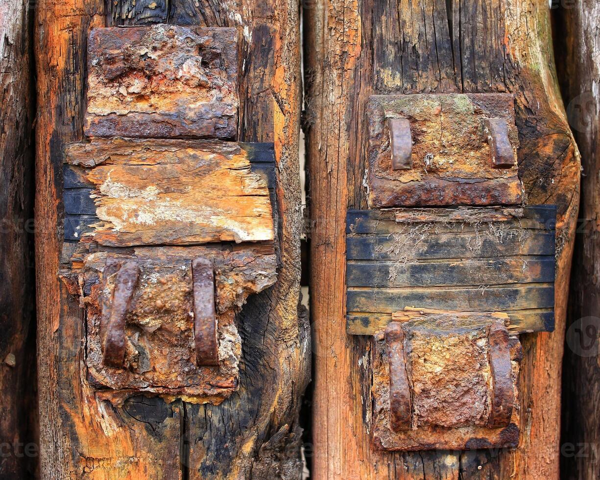 Close up of old weathered railway sleeper fastening photo
