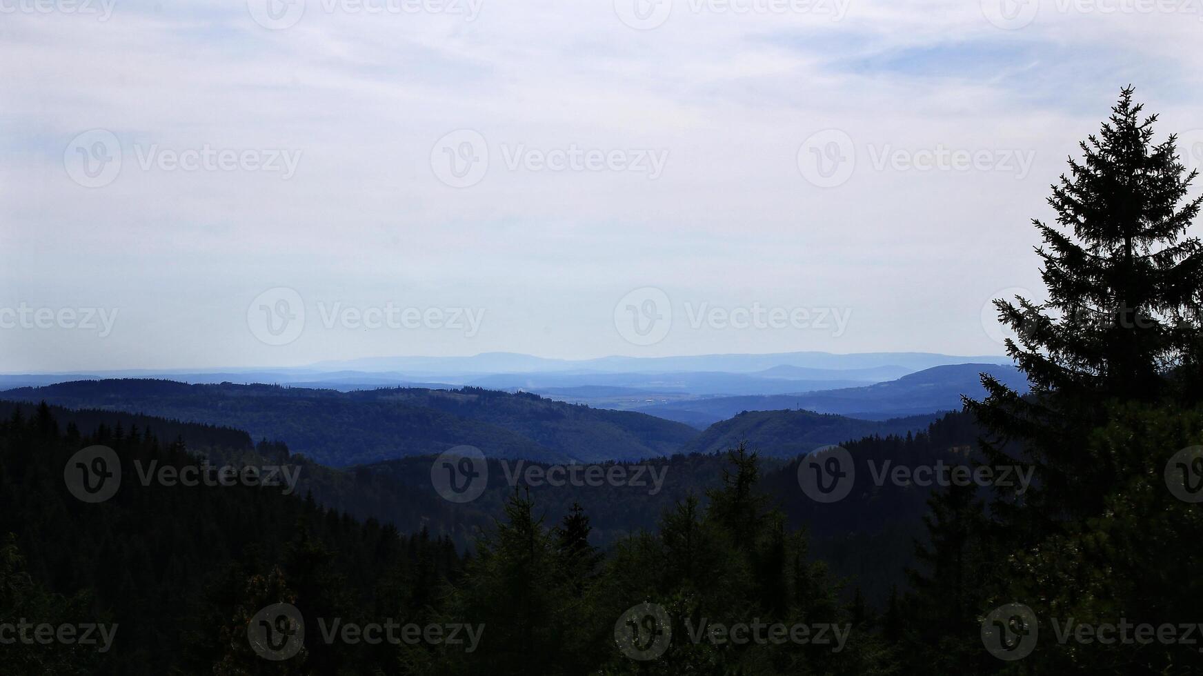 Mountainous landscape layers stretch across the horizon in the Thuringian forest photo