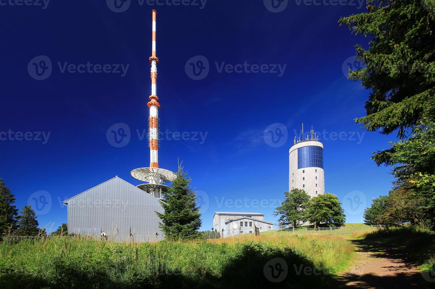 Grosser inselsberg summit in Thuringia with modern telecommunications tower photo