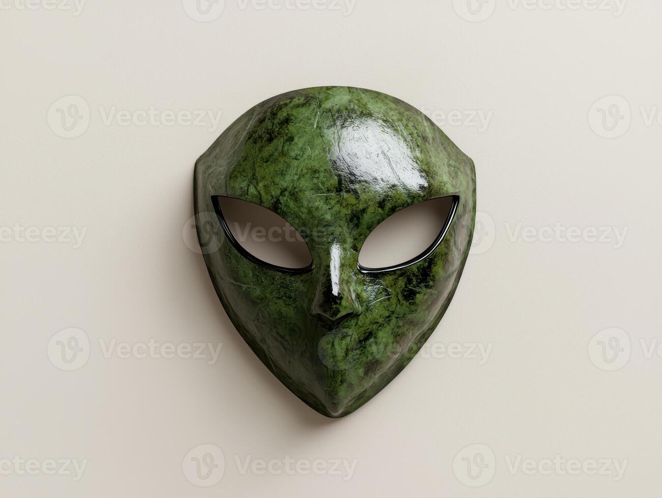 Green alien mask on beige background photo