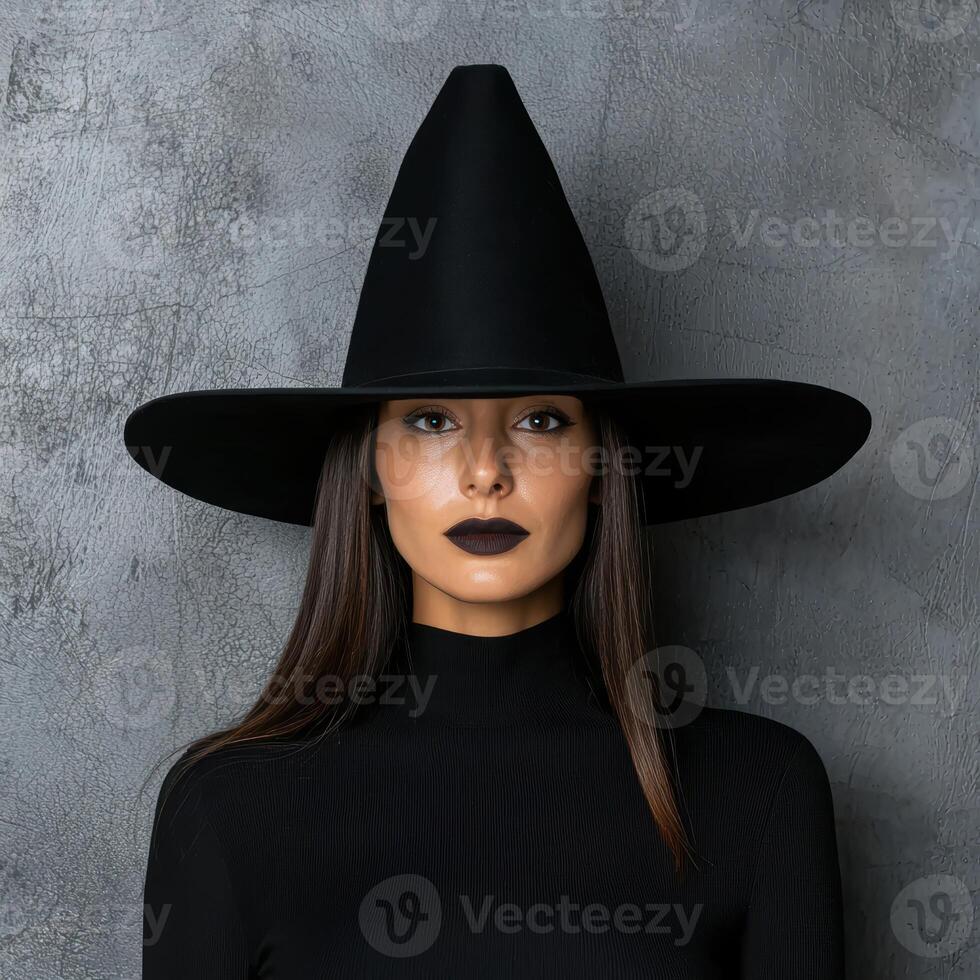 Woman in black witch hat and turtleneck photo