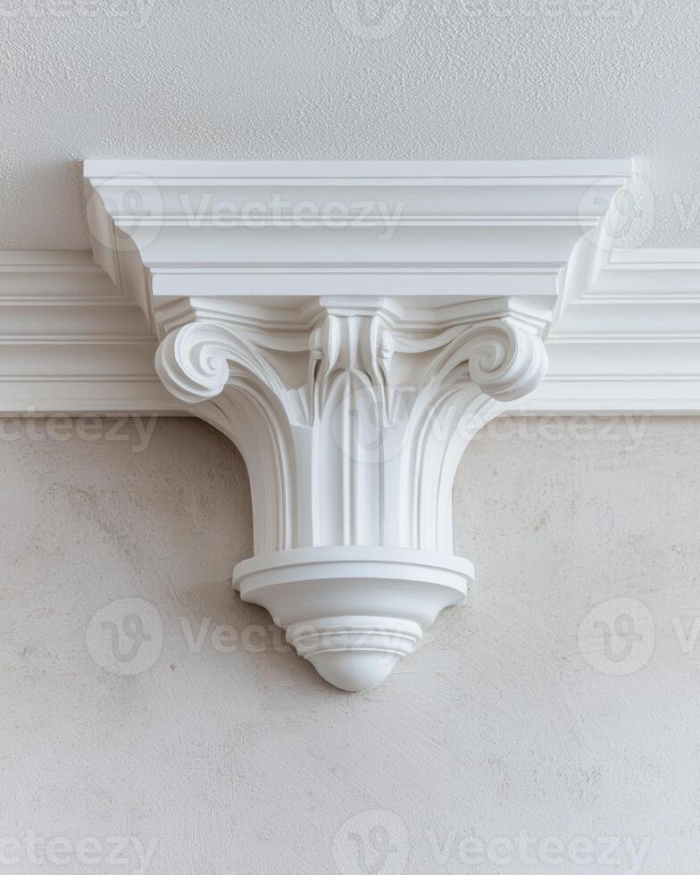 White ornate crown molding detail on ceiling photo