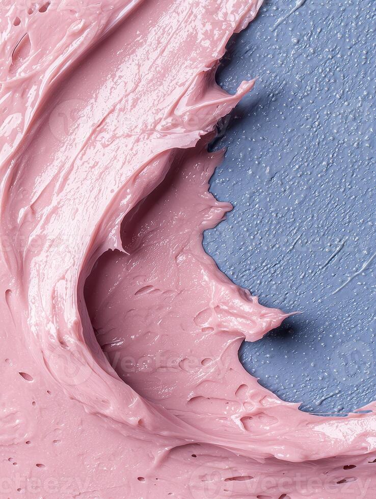 Close up of pink cream texture on a blue background photo