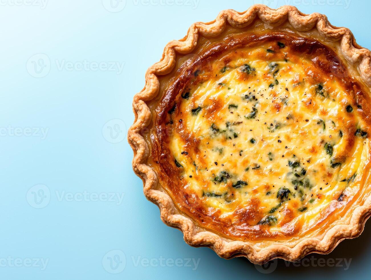 Delicious homemade spinach and cheese quiche in a flaky crust photo