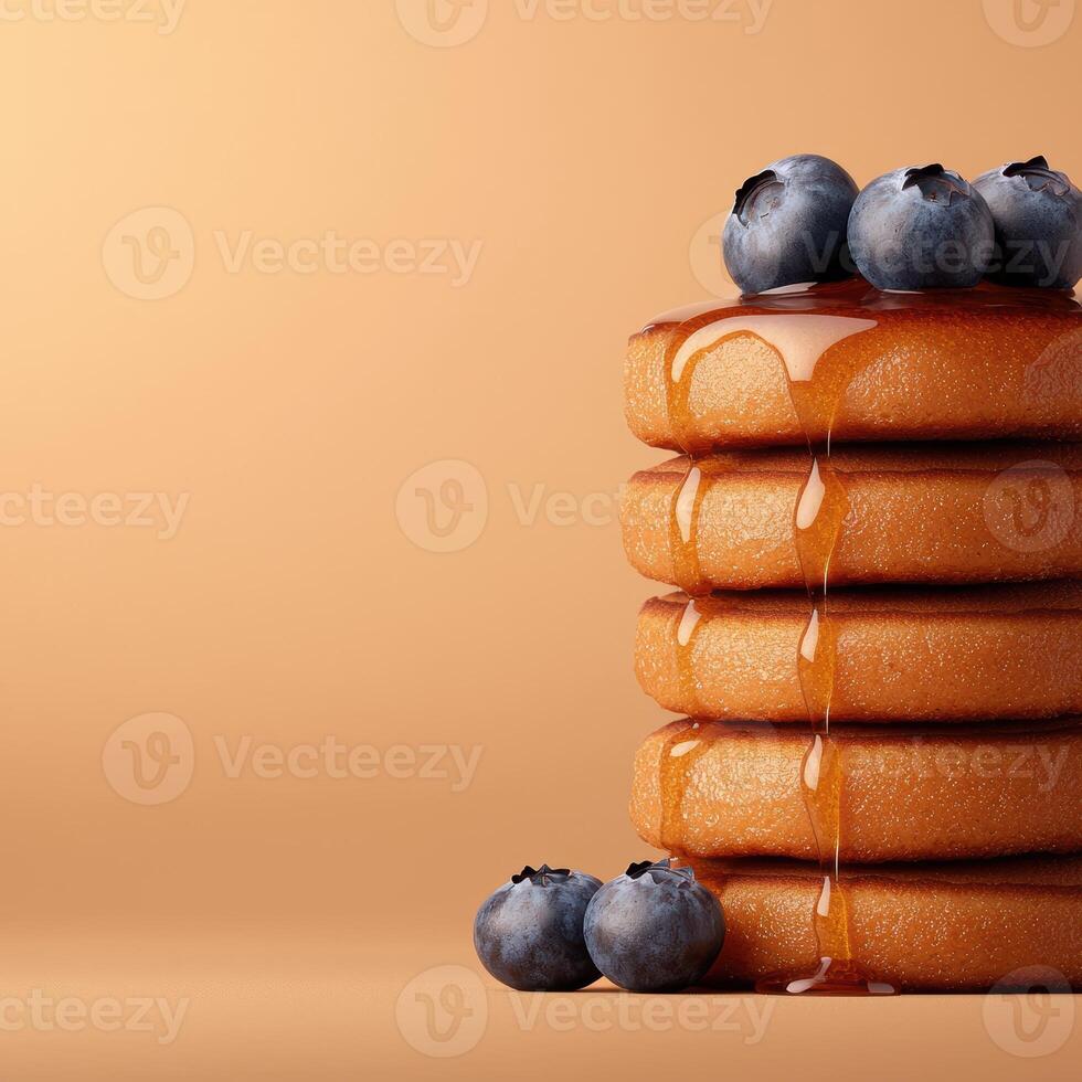 Stack of pancakes with blueberries and syrup photo