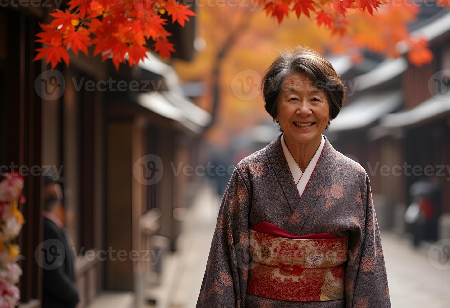 An elderly Japanese woman smiles while strolling through the timeless streets of Kyoto's old town. . photo