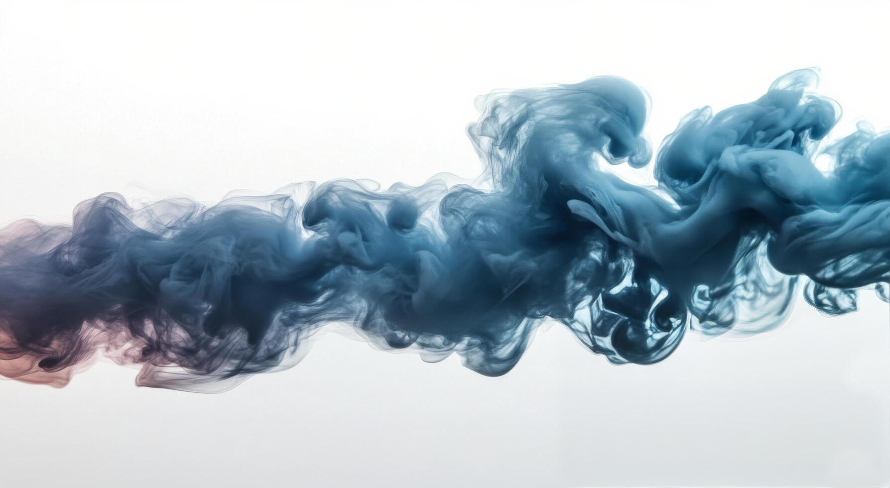 Blue ink swirling in water creating abstract shapes and patterns photo